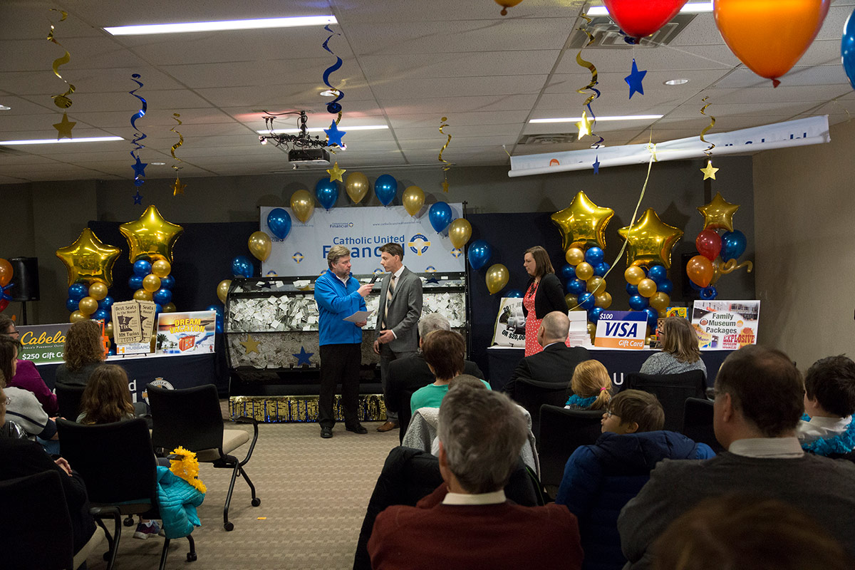 AM1500 Radio's The Rookie interviews Nate Lamusga, Director of our Member Engagement department during the 2017 Catholic Schools Raffle prize drawing ceremony.