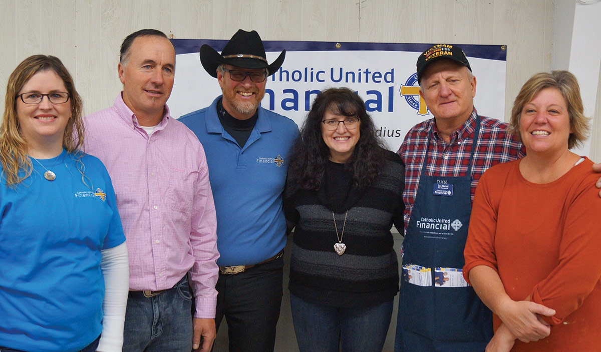 Sales Rep Dan Markell and parish volunteers