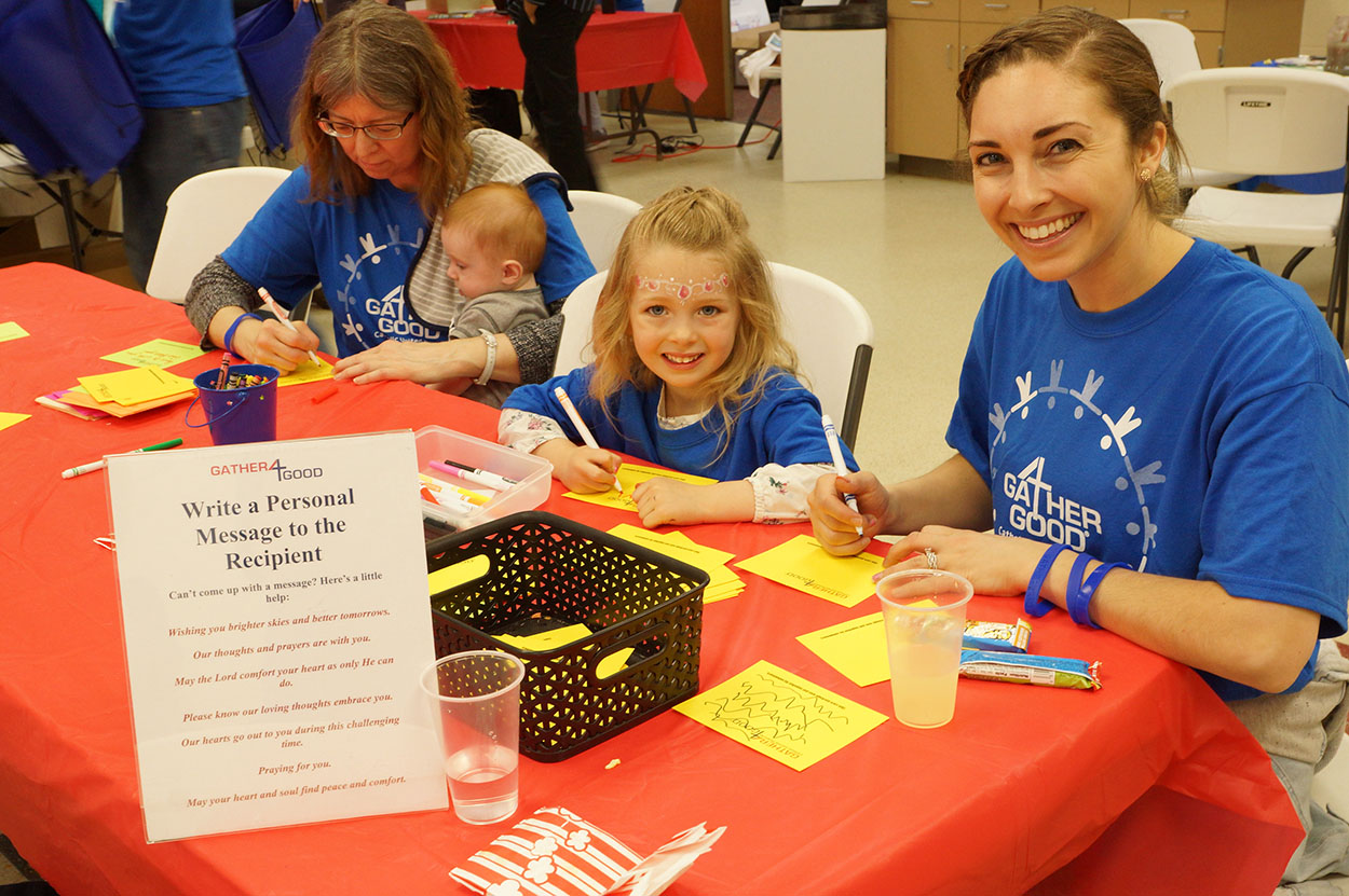 Families sign encouragement cards during the Medford event in May 2018.