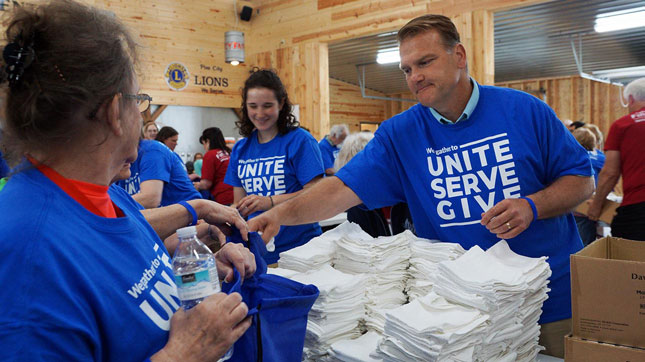 Volunteers help assembled care kits in Pine City, MN