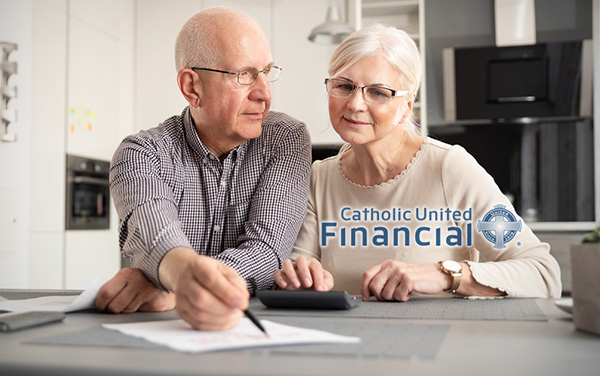 Older couple reviewing their Med Supp paperwork and calculations