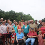 Large family photo on deck of family home