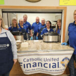 Impact team serving dinner at a church