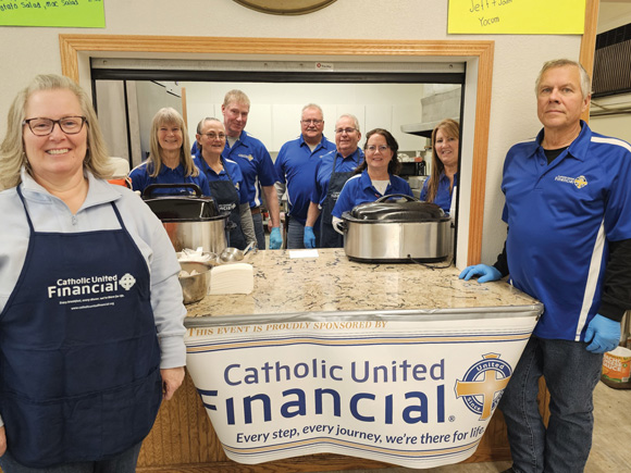 Impact team serving dinner at a church